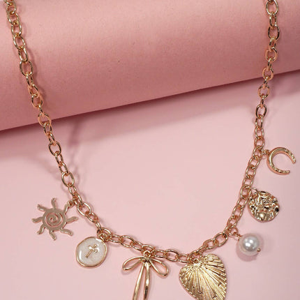 SUN BOW PEARL CROSS DISC  CHARM NECKLACE