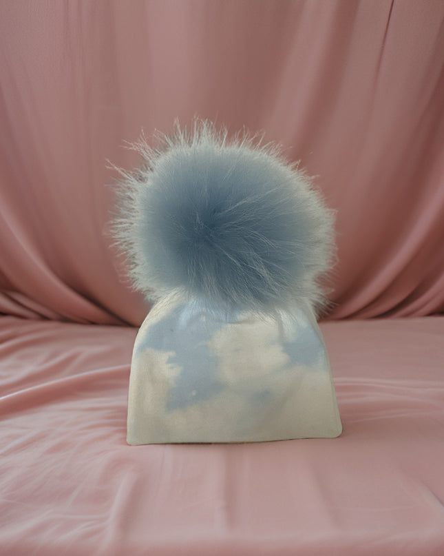 Personalized cotton hat with fur pom — shown on baby