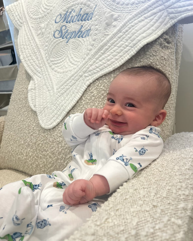 Personalized baby quilt — shown with embroidered name in pink