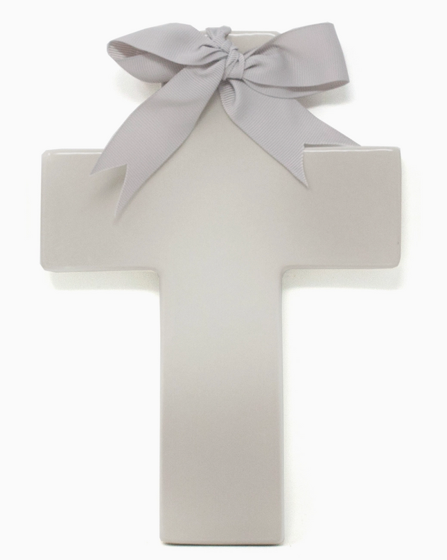 Personalized ceramic ombre cross — styled on shelf with baby items