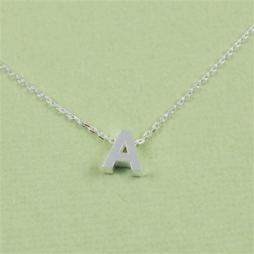 Block letter initial necklace — shown on model
