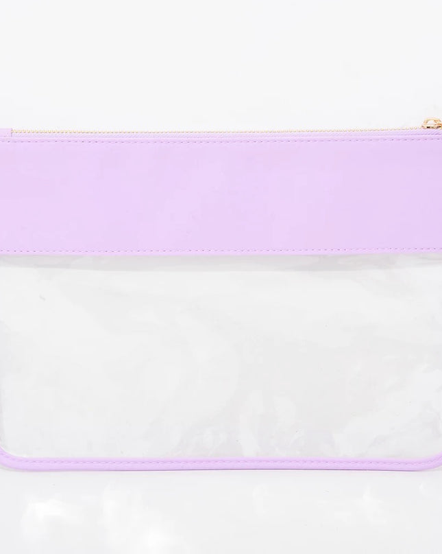 The Allie clear pouch — shown with essentials inside
