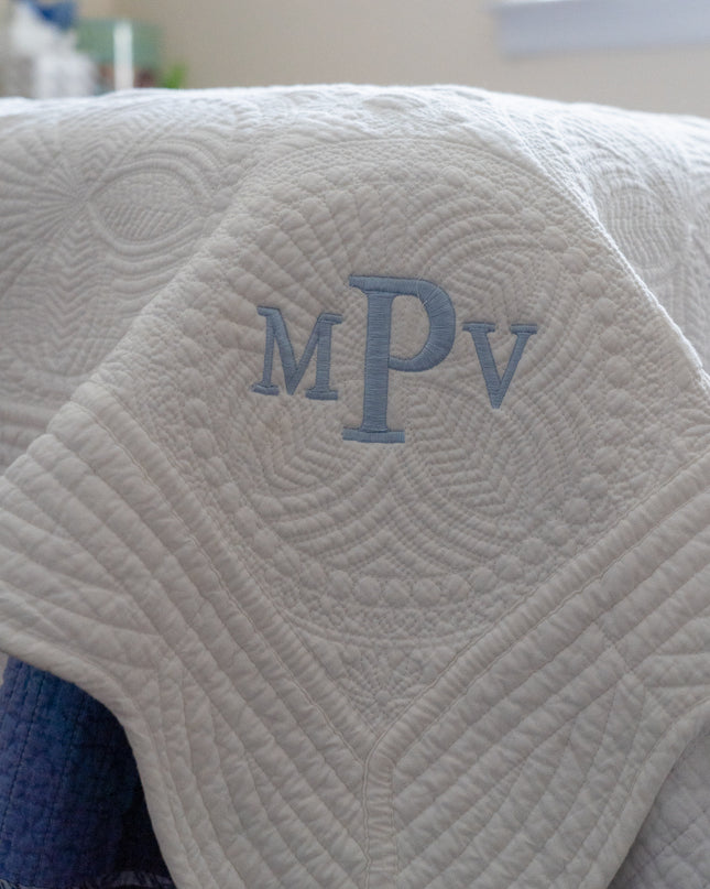 Personalized baby quilt — shown folded, ready to gift