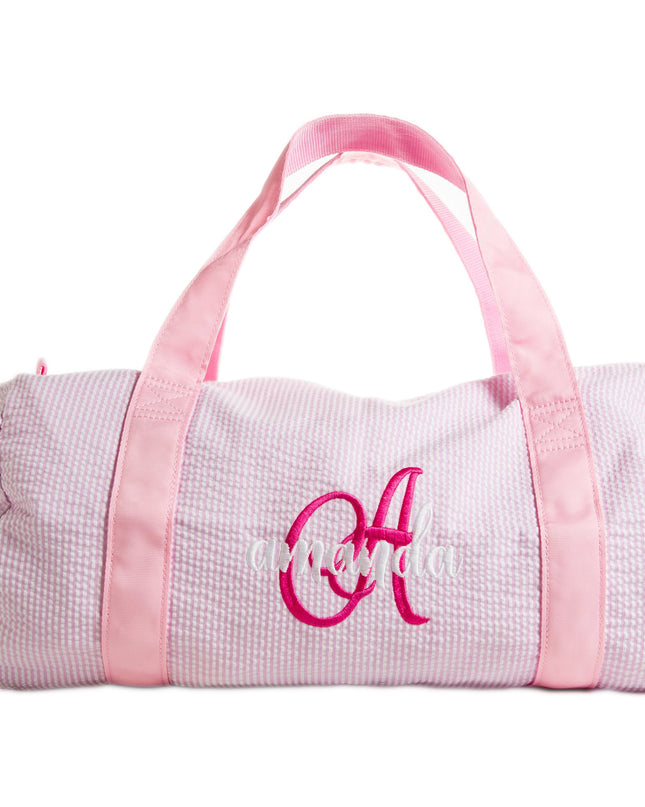 Oh Mint personalized children's duffel — shown open with contents