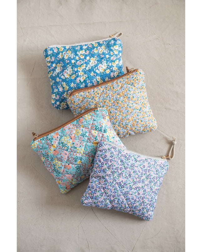Quilted floral chintz zip pouch — shown open with contents