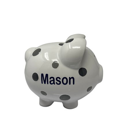 Personalized polka dot piggy bank — shown with coins being dropped in